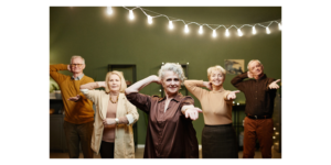 A group of fashionable active seniors posing for a dance in their senior community.