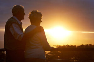 A couple of seniors watching over the sunset